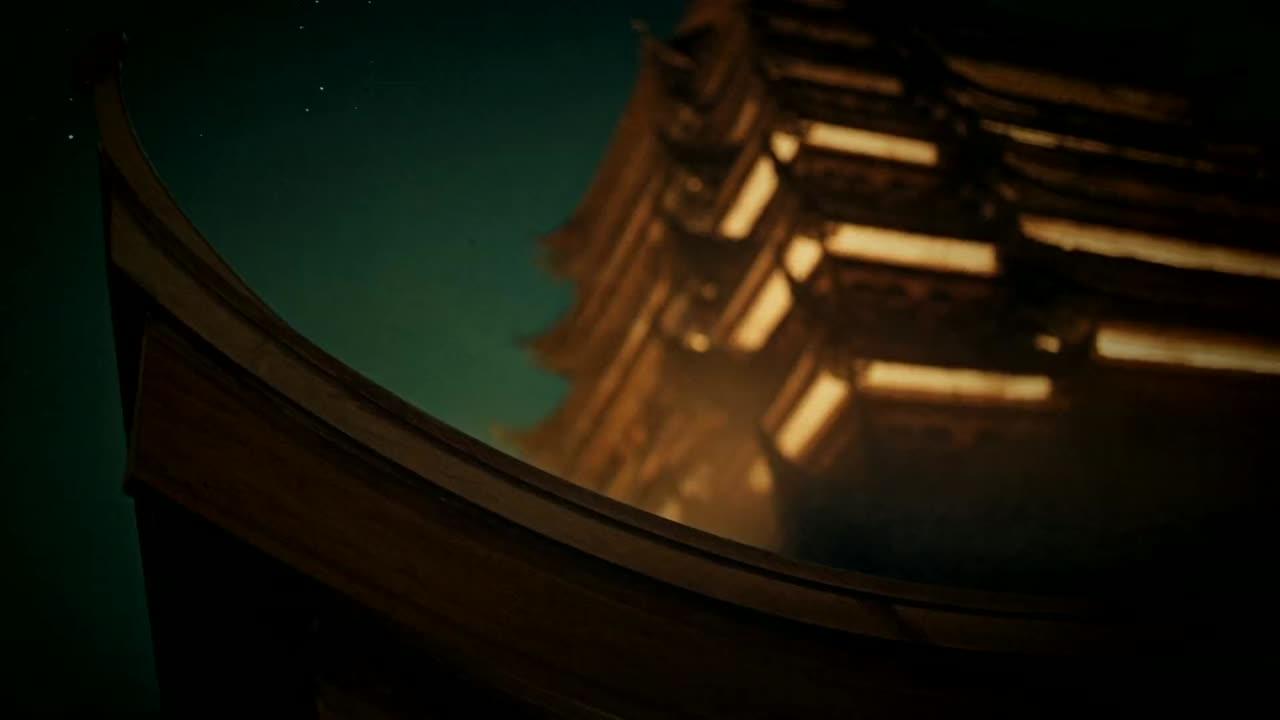 A tiered pagoda glowing warm above a forested ridge at dusk, with the lights of a valley town below.